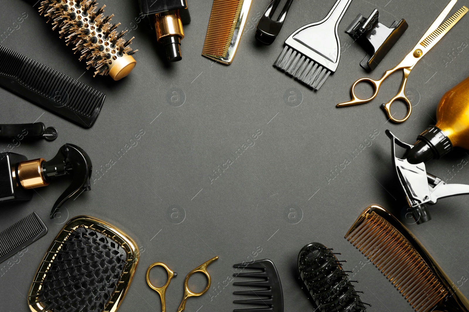 Photo of Frame of hairdressing tools on dark background, flat lay. Space for text