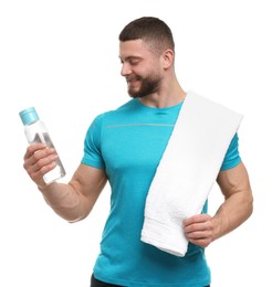 Photo of Handsome man with bottle of water and towel on white background