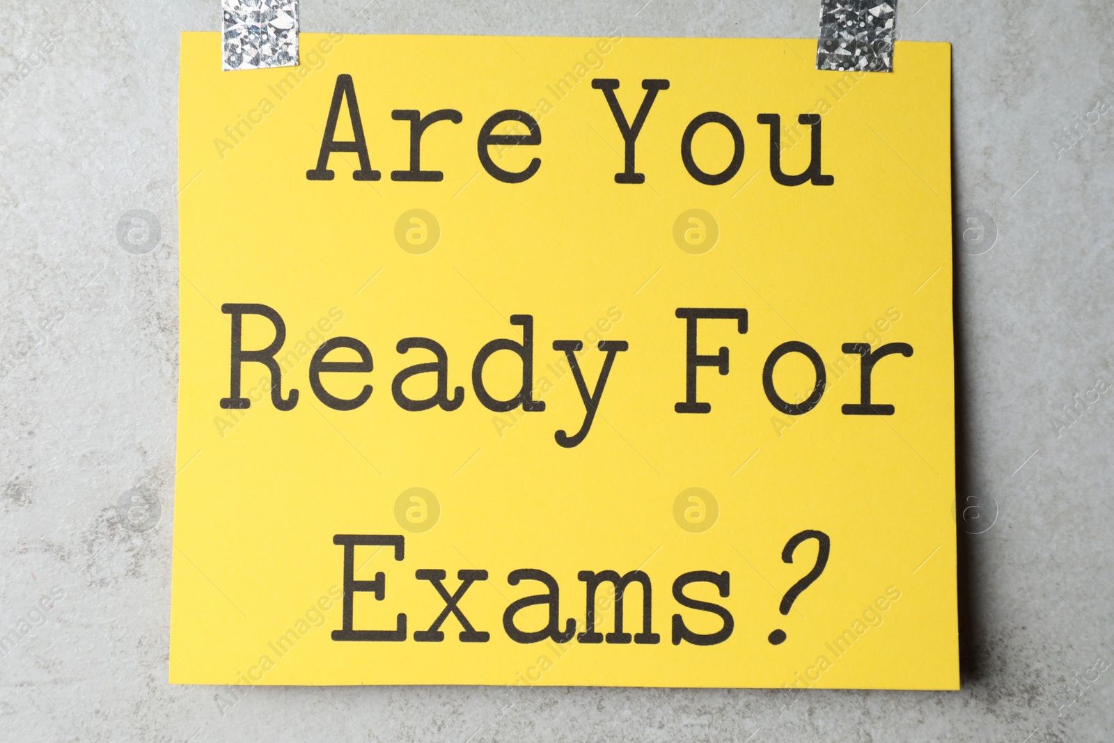 Photo of Sheet of paper with question Are You Ready For Exams? on grey table, top view