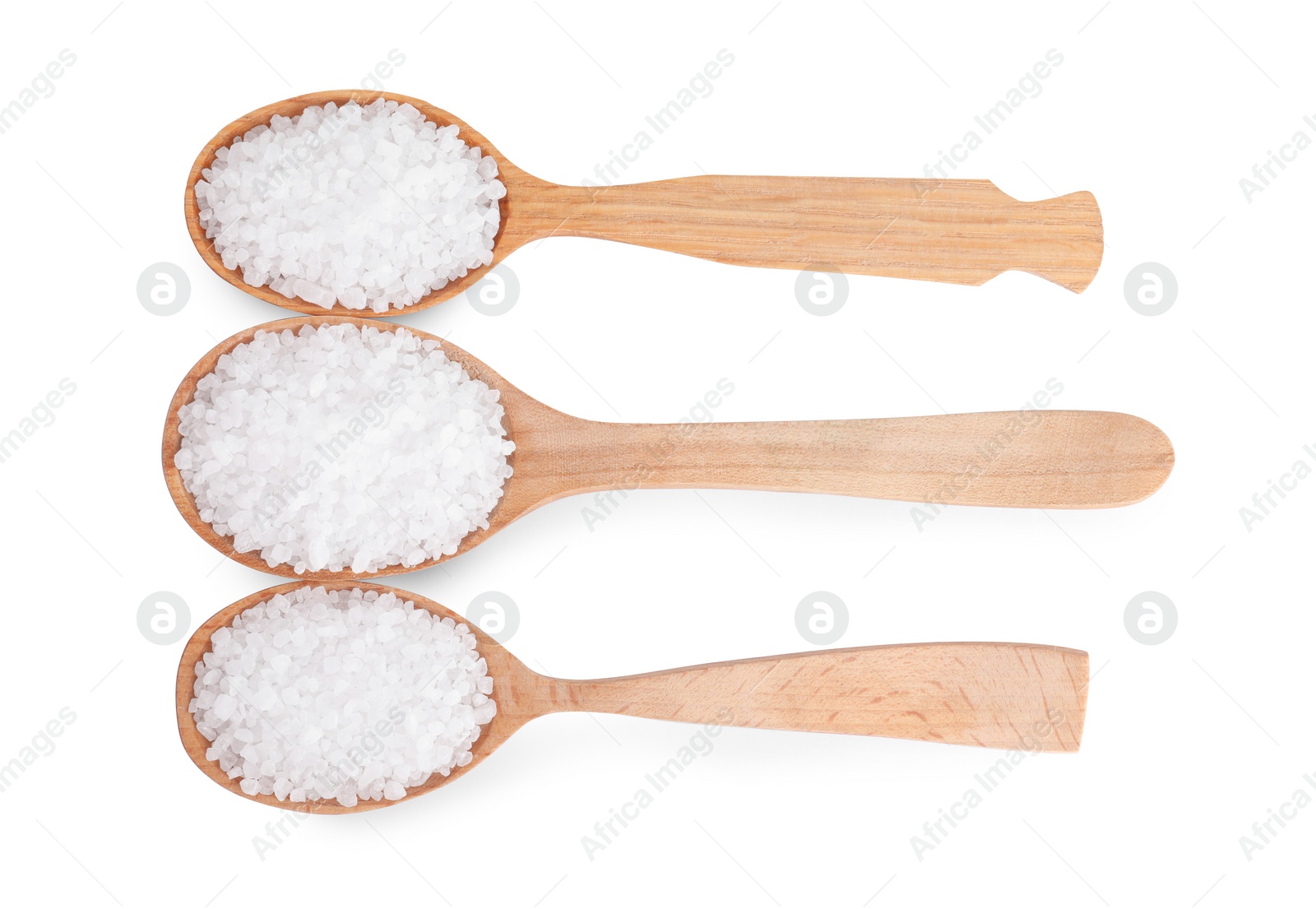 Photo of Wooden spoons with natural sea salt isolated on white, top view