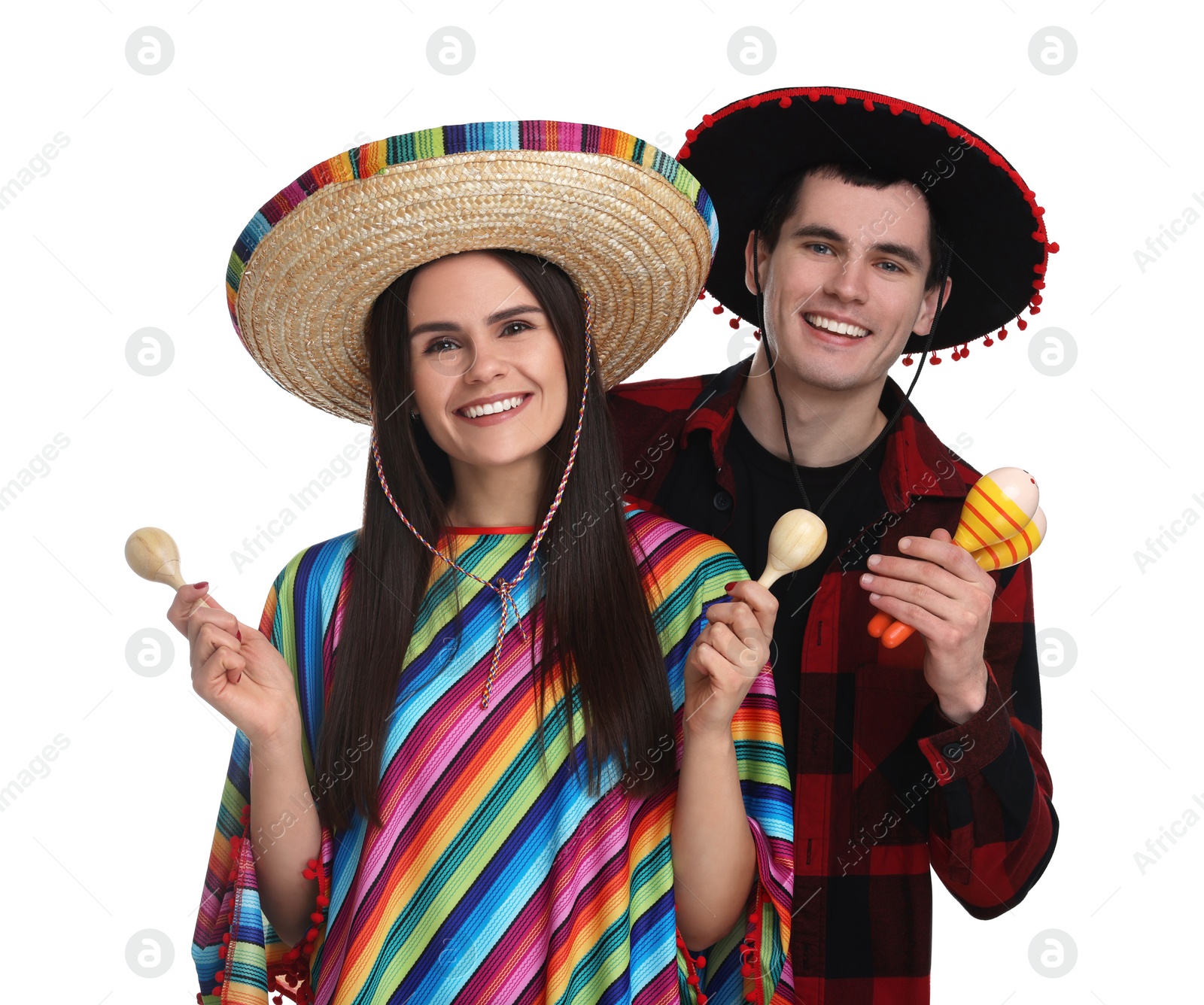 Photo of Lovely couple in Mexican sombrero hats with maracas on white background