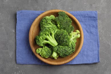 Fresh green broccoli on grey table, top view