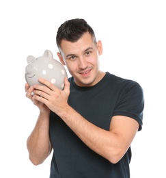 Photo of Portrait of man with piggy bank on white background