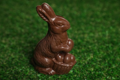 Chocolate bunny on green grass. Easter celebration