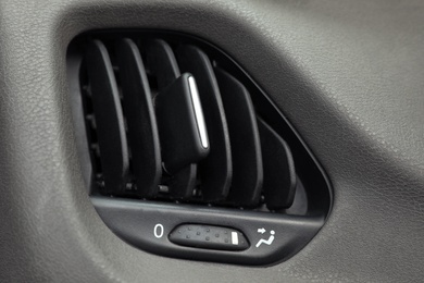 Photo of Air conditioner system in modern car, closeup