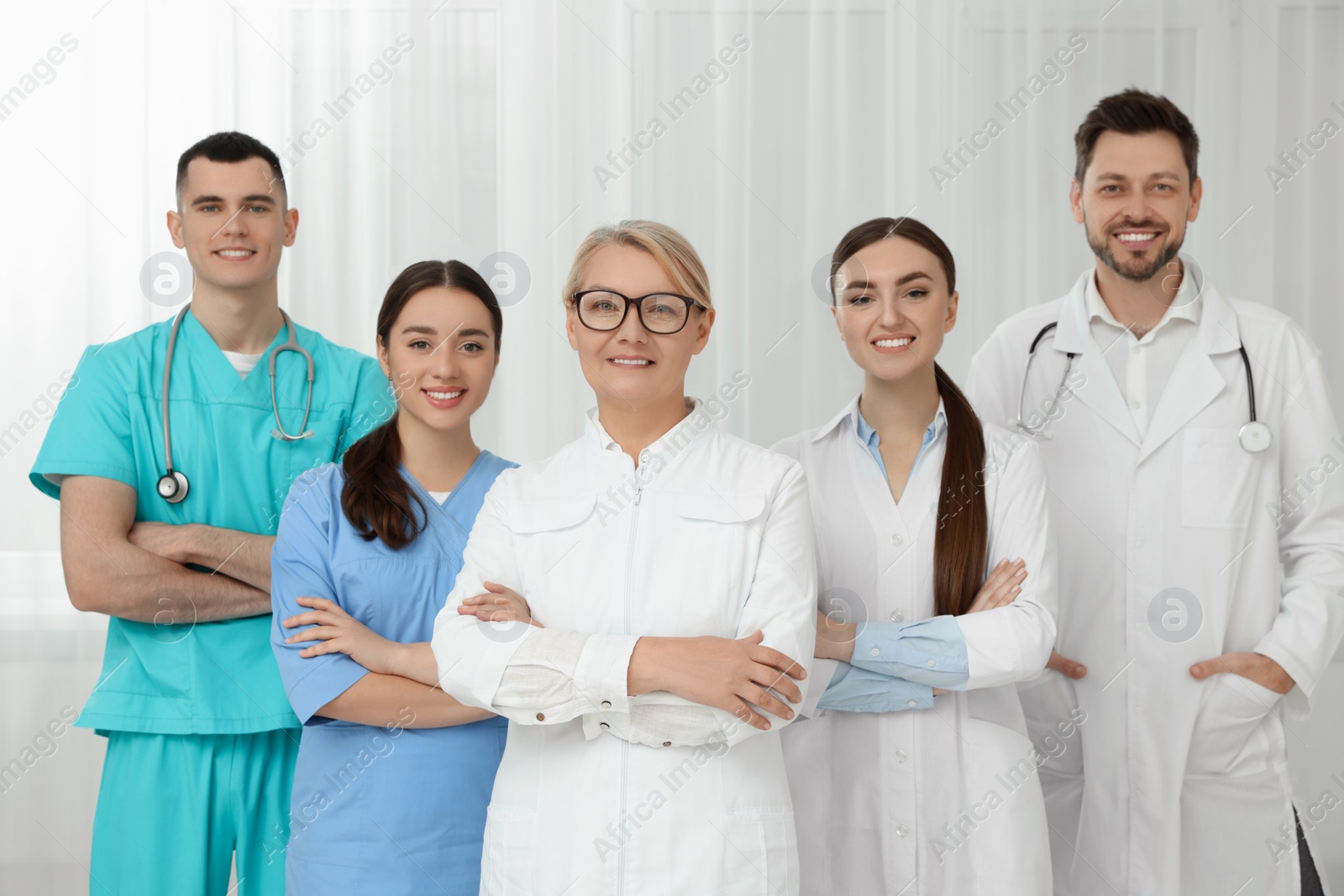 Photo of Portrait of medical doctors wearing uniforms indoors