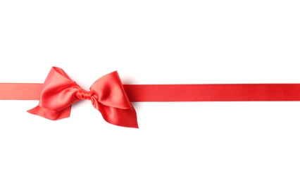 Red ribbon with bow on white background. Festive decoration