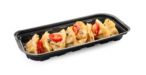 Delicious gyoza (asian dumplings) with sesame and pepper isolated on white