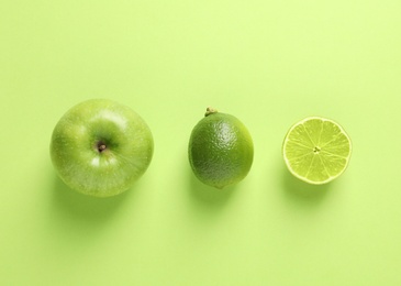 Photo of Flat lay composition with fresh fruits on color background