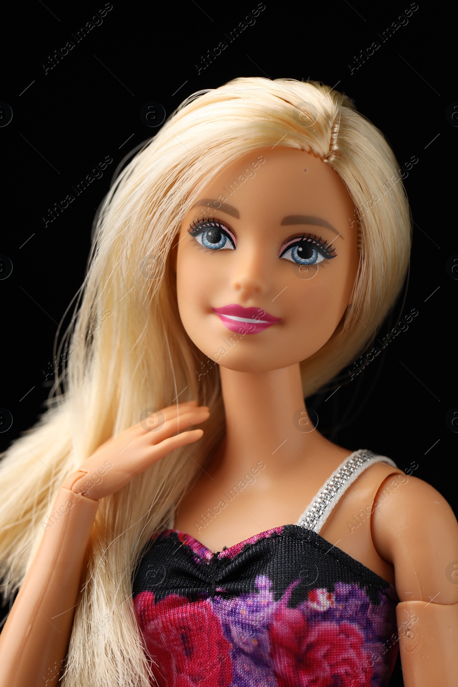 Photo of Mykolaiv, Ukraine - September 1, 2023: Beautiful Barbie doll on black background