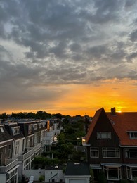 Picturesque view of city street with beautiful buildings at sunrise