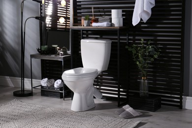 Photo of Stylish bathroom interior with toilet bowl and other essentials