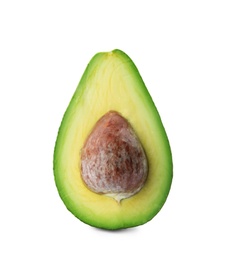 Half of ripe avocado with pit on white background