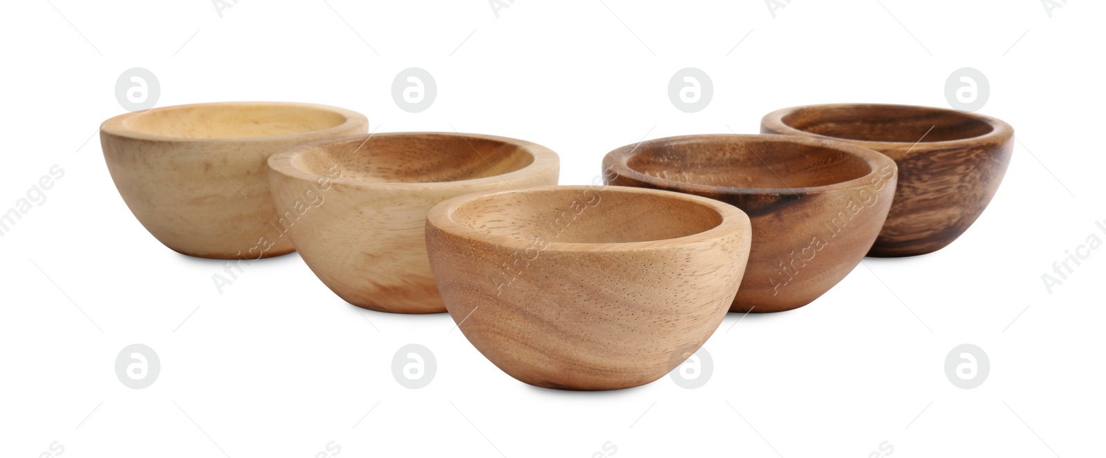 Photo of Set of wooden bowls on white background