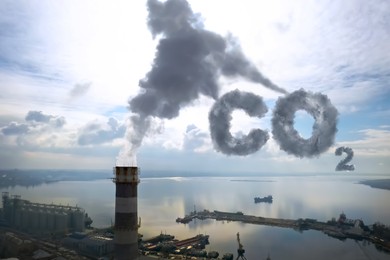 Image of Inscription CO2 made of smoke. Industrial factory polluting air, aerial view