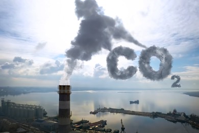 Inscription CO2 made of smoke. Industrial factory polluting air, aerial view