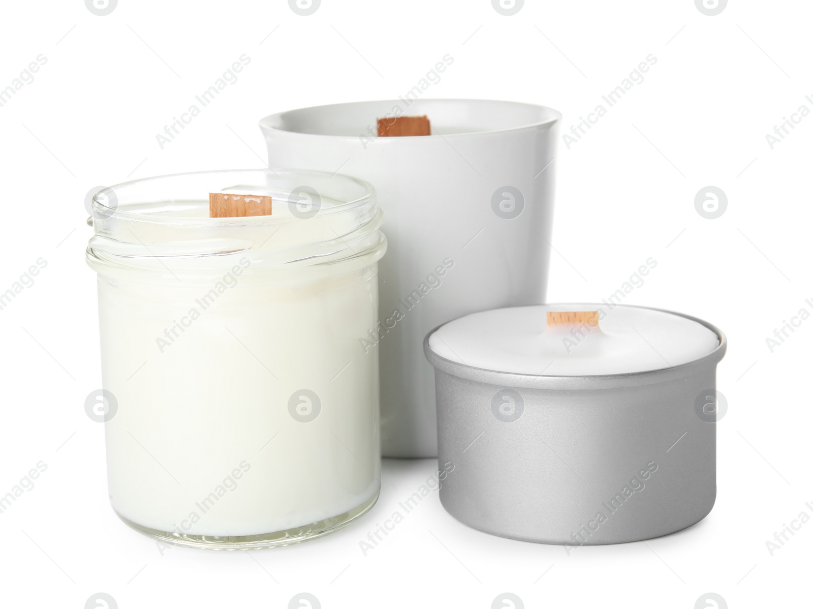 Photo of Beautiful candles with wooden wicks on white background