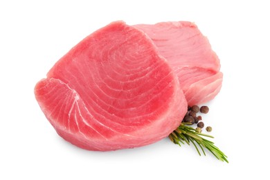 Photo of Fresh raw tuna fillets, peppercorns and rosemary on white background
