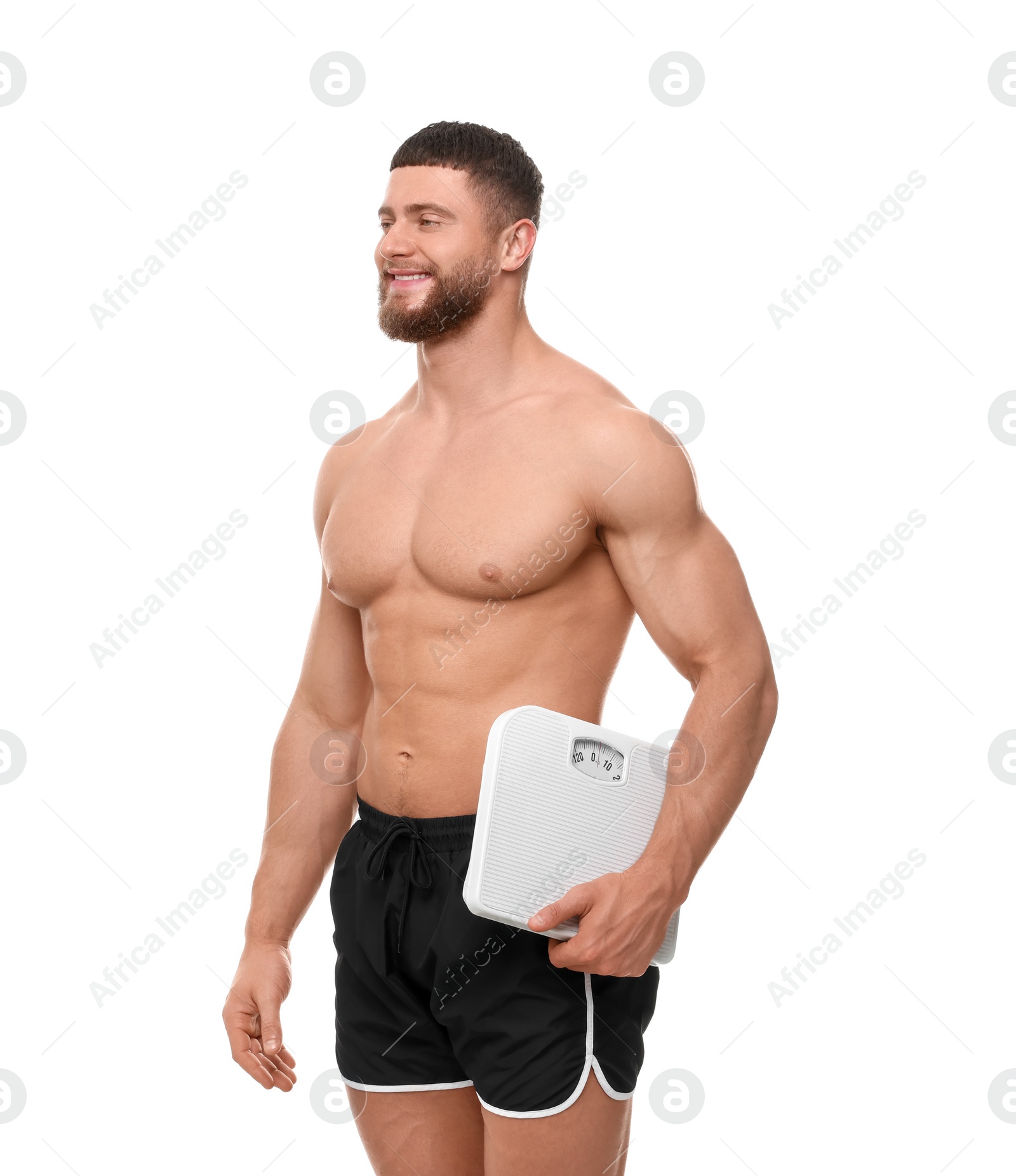 Photo of Portrait of happy athletic man with scales on white background. Weight loss concept