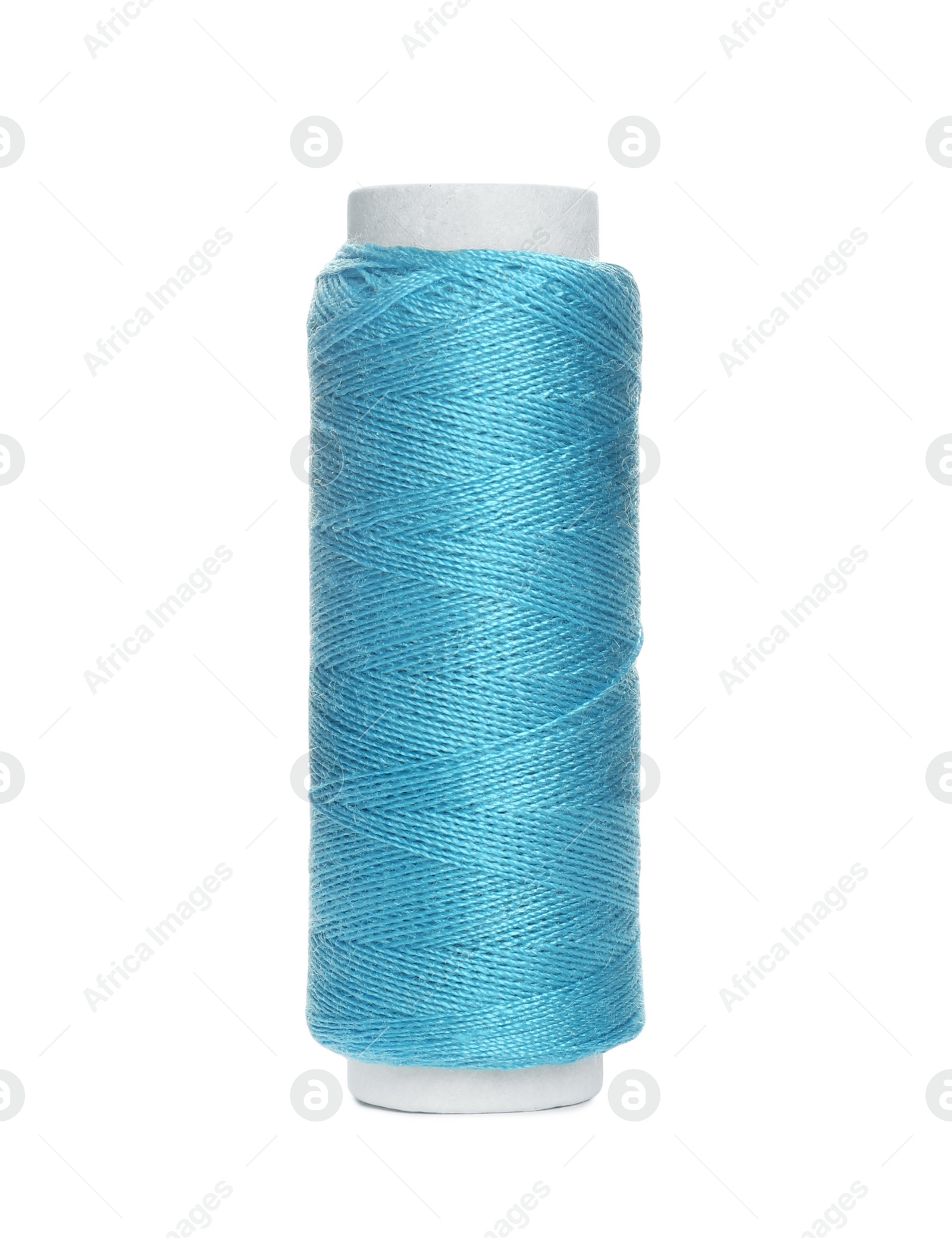 Photo of Spool of light blue sewing thread isolated on white