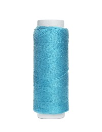 Spool of light blue sewing thread isolated on white