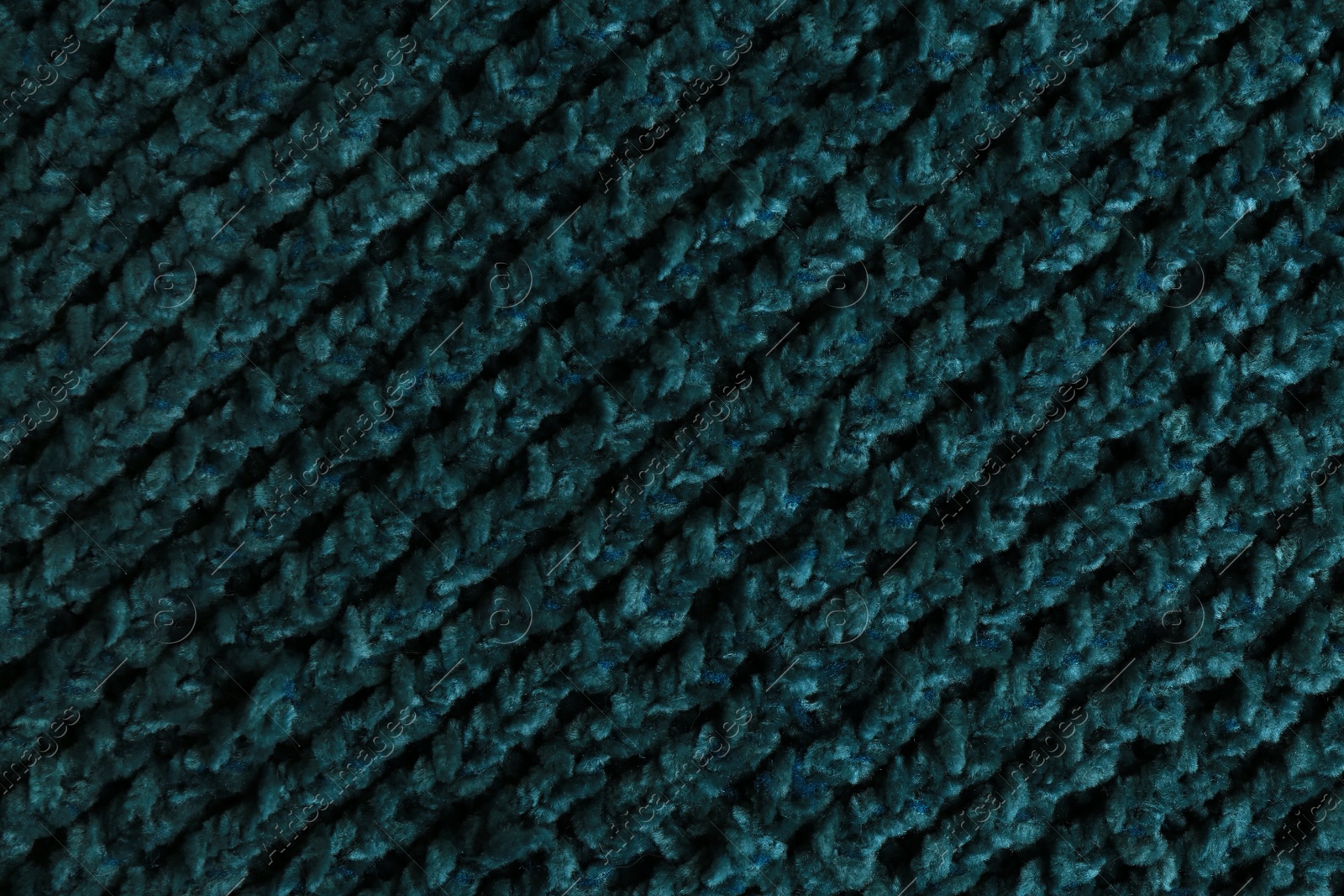 Photo of Beautiful dark knitted fabric as background, top view