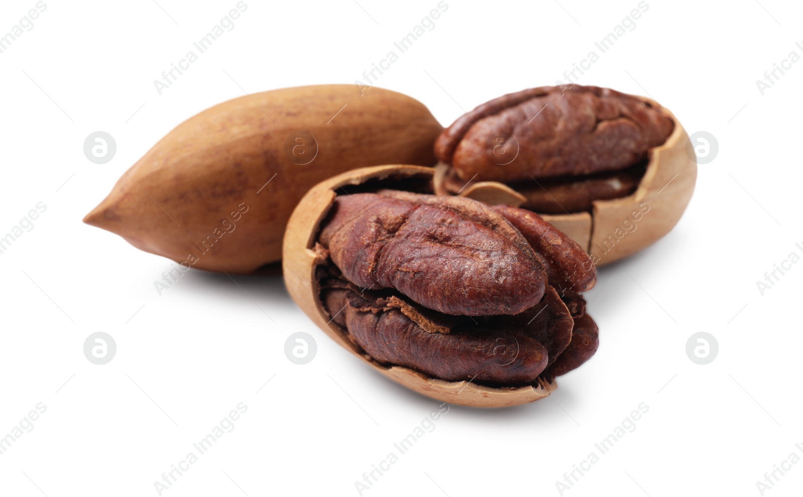 Photo of Three tasty pecan nuts isolated on white