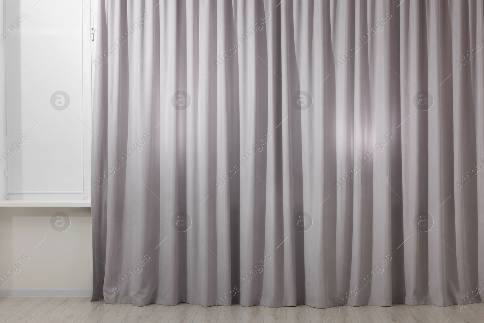 Photo of Light grey window curtains in living room