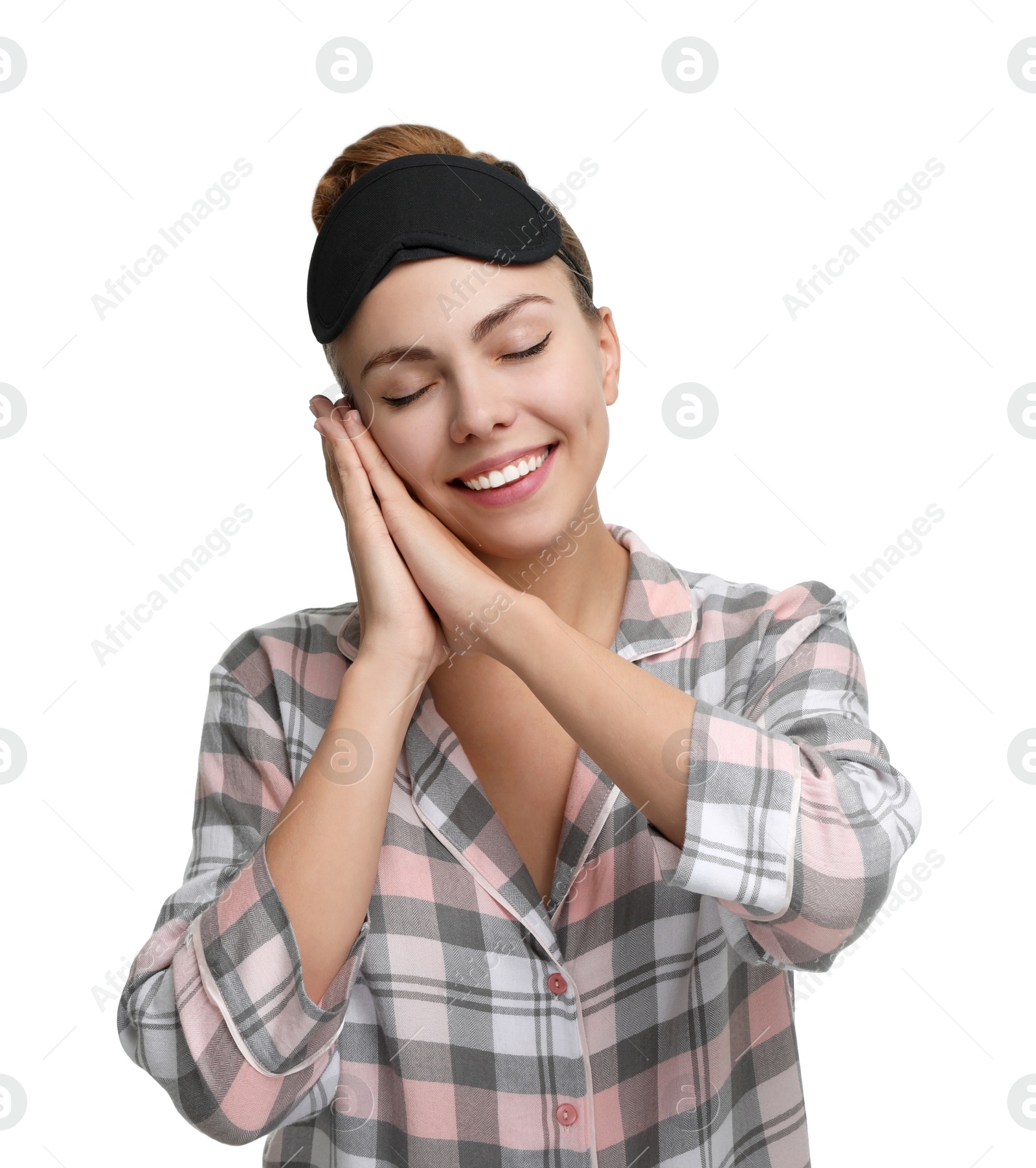 Photo of Beautiful woman wearing pajamas and sleeping mask on white background. Bedtime