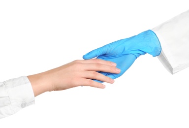 Photo of Doctor in medical glove holding hands with patient on white background