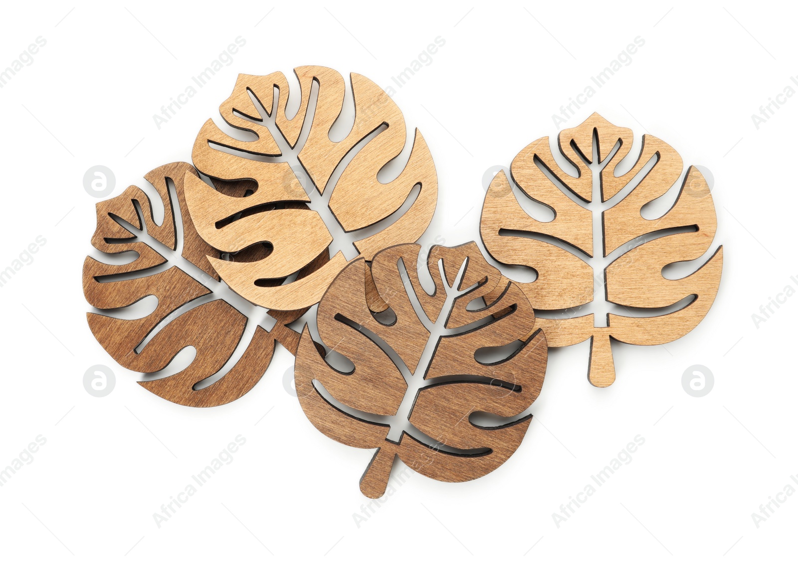 Photo of Leaf shaped wooden cup coasters on white background, top view