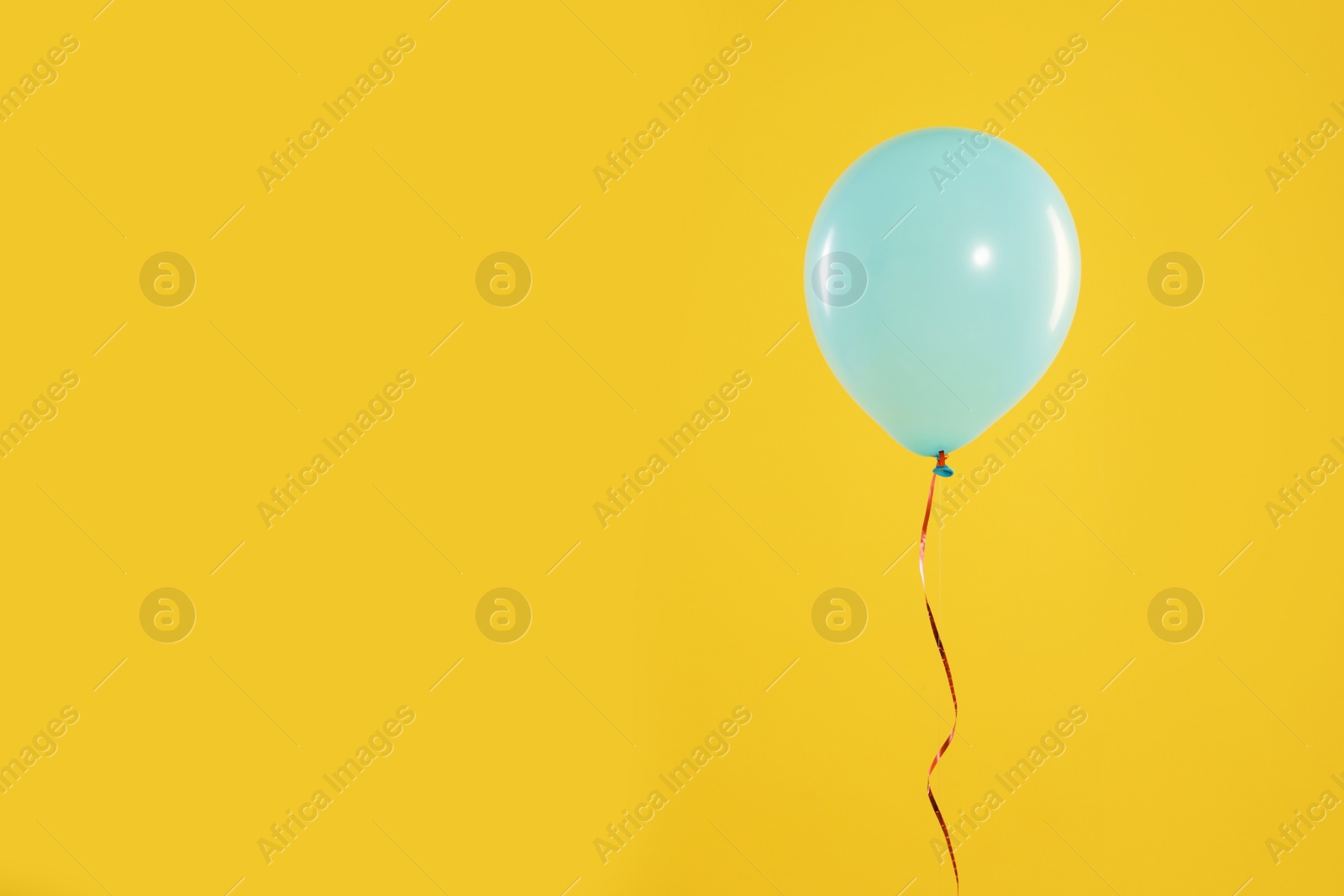 Photo of Bright balloon on color background, space for text. Celebration time