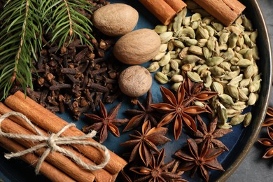 Different spices and nuts on table, top view