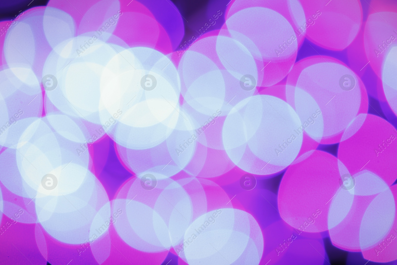 Photo of Beautiful glowing lights as background. Bokeh effect