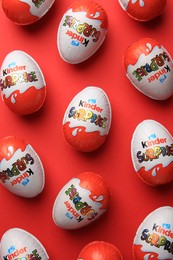 Photo of Sveti Vlas, Bulgaria - June 27, 2023: Kinder Surprise Eggs on red background, flat lay