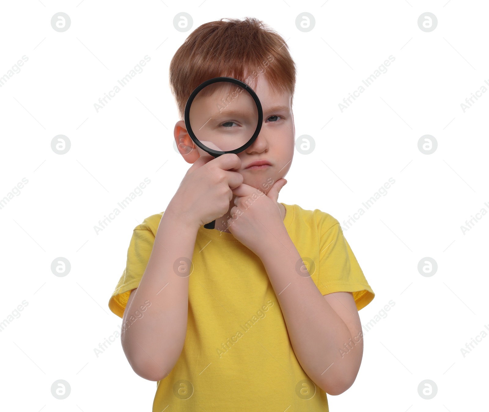 Photo of Thoughtful boy looking through magnifier glass on white background