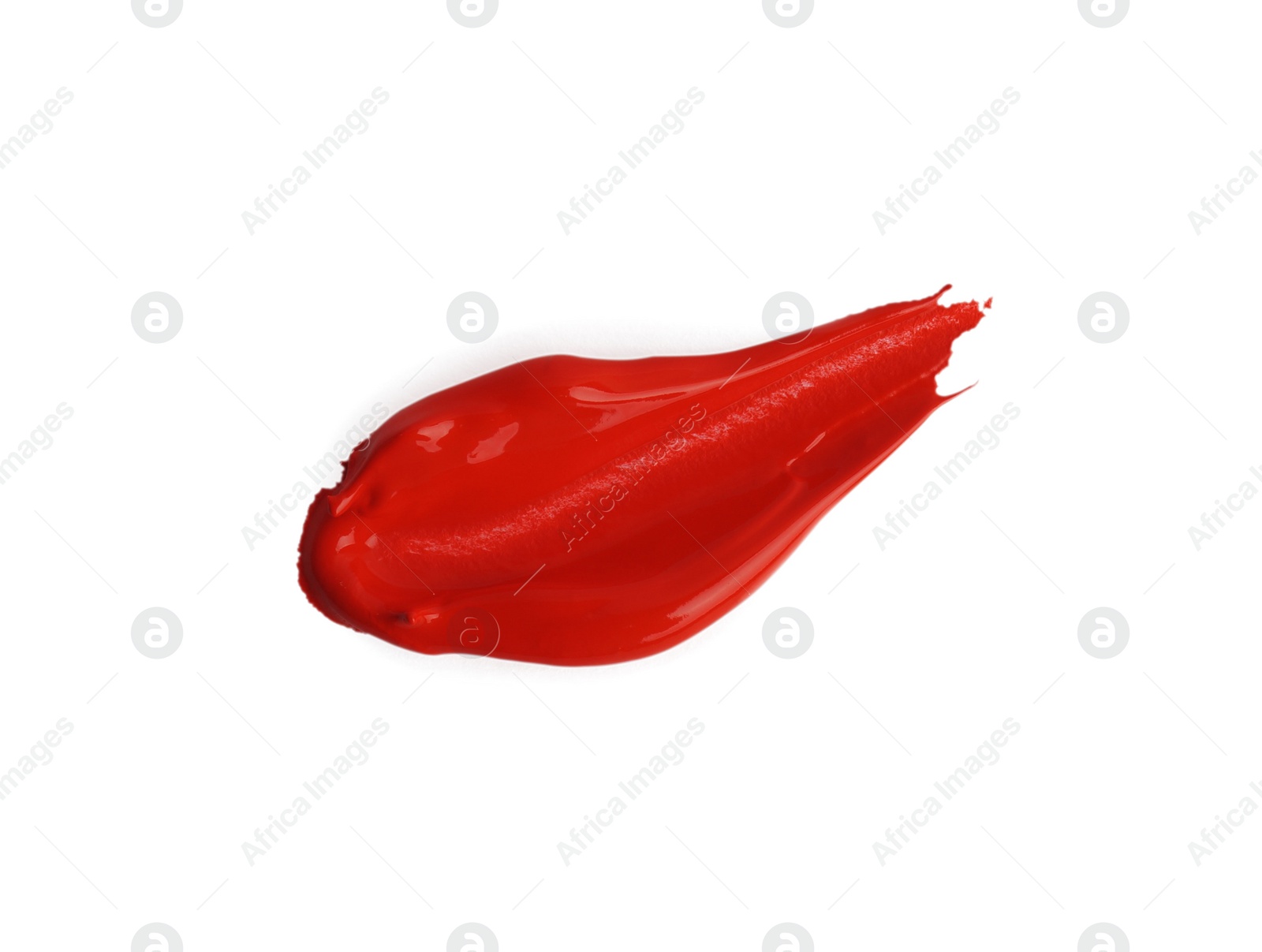 Photo of Red paint stroke drawn with brush on white background, top view