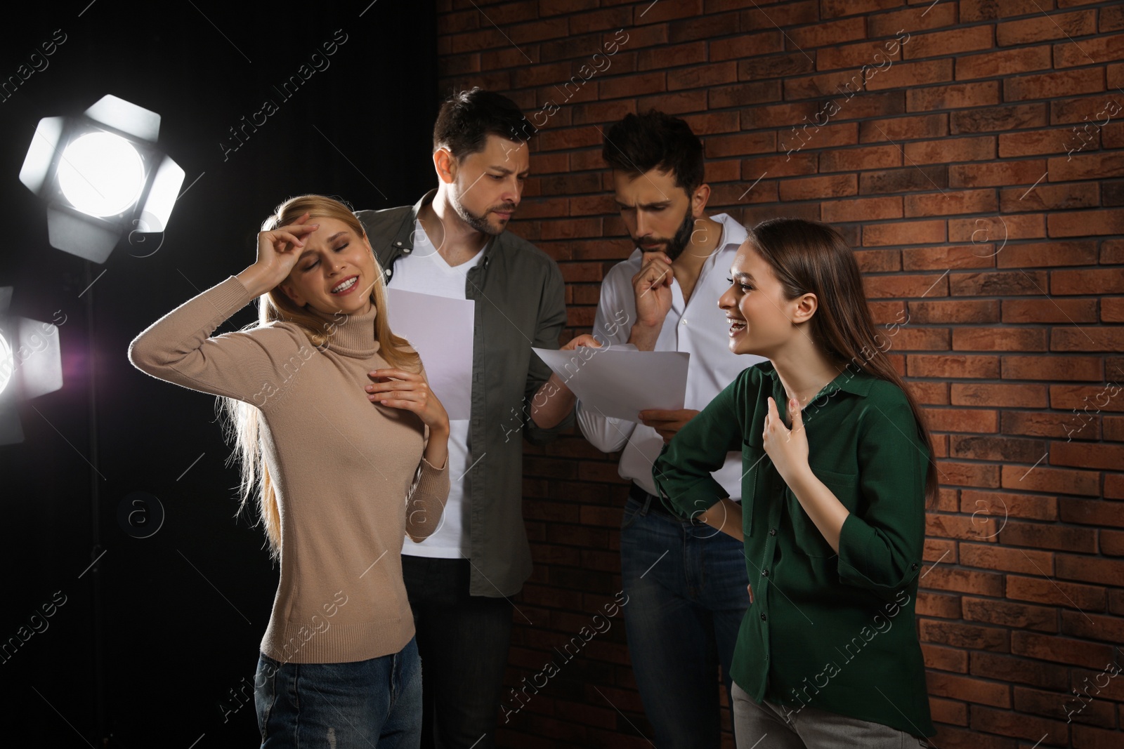 Photo of Professional actors rehearsing on stage in theatre