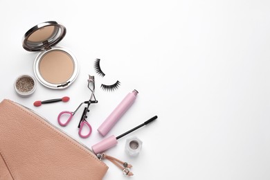 Photo of Composition with eyelash curler and makeup products on white background, top view