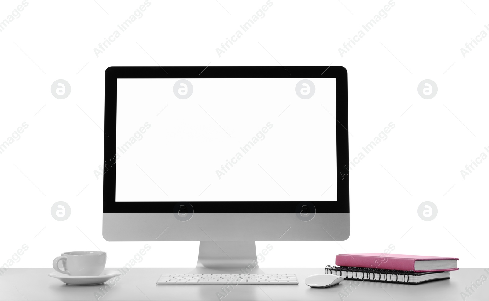 Photo of Computer, cup of tea and notebooks on table against white background. Stylish workplace