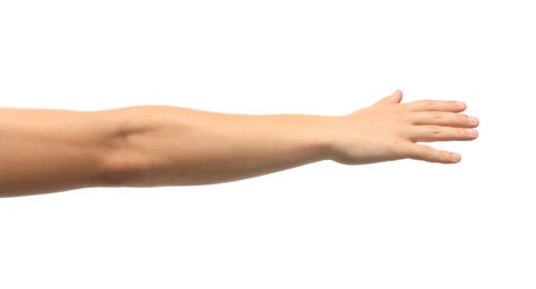 Photo of Young man held out hand on white background, closeup