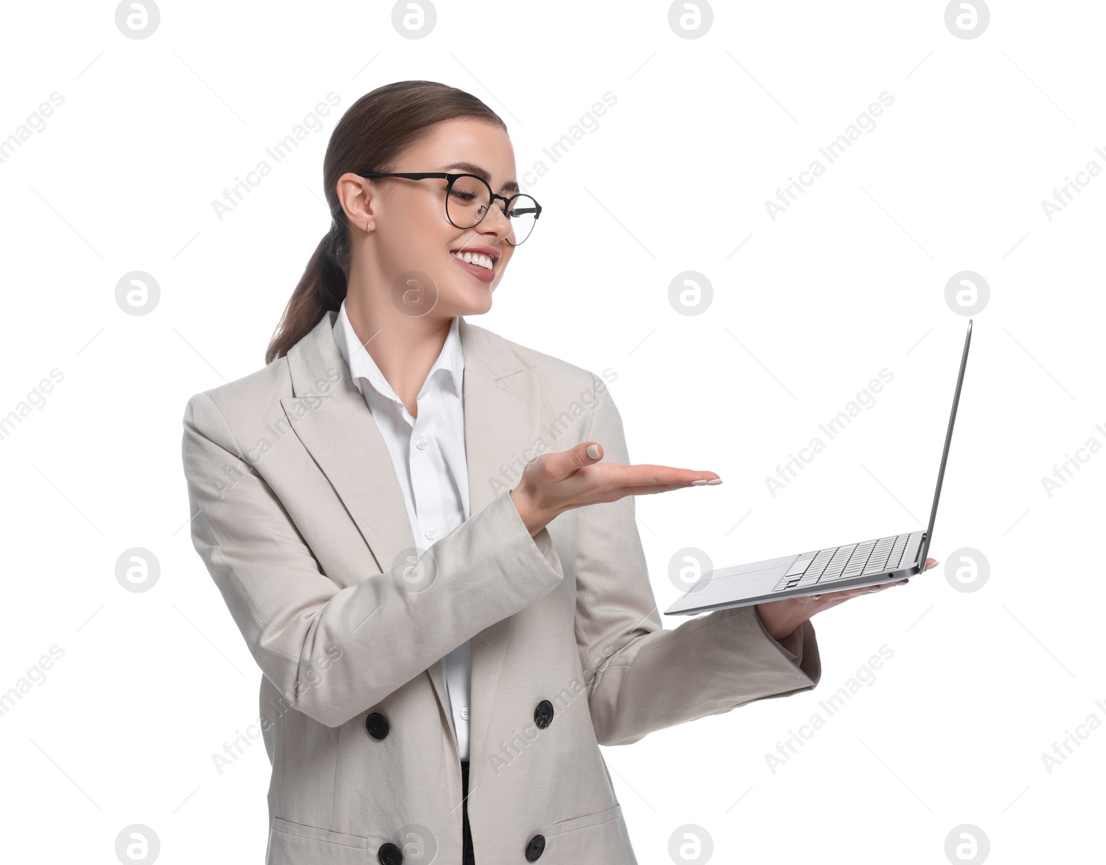 Photo of Happy woman pointing at laptop on white background