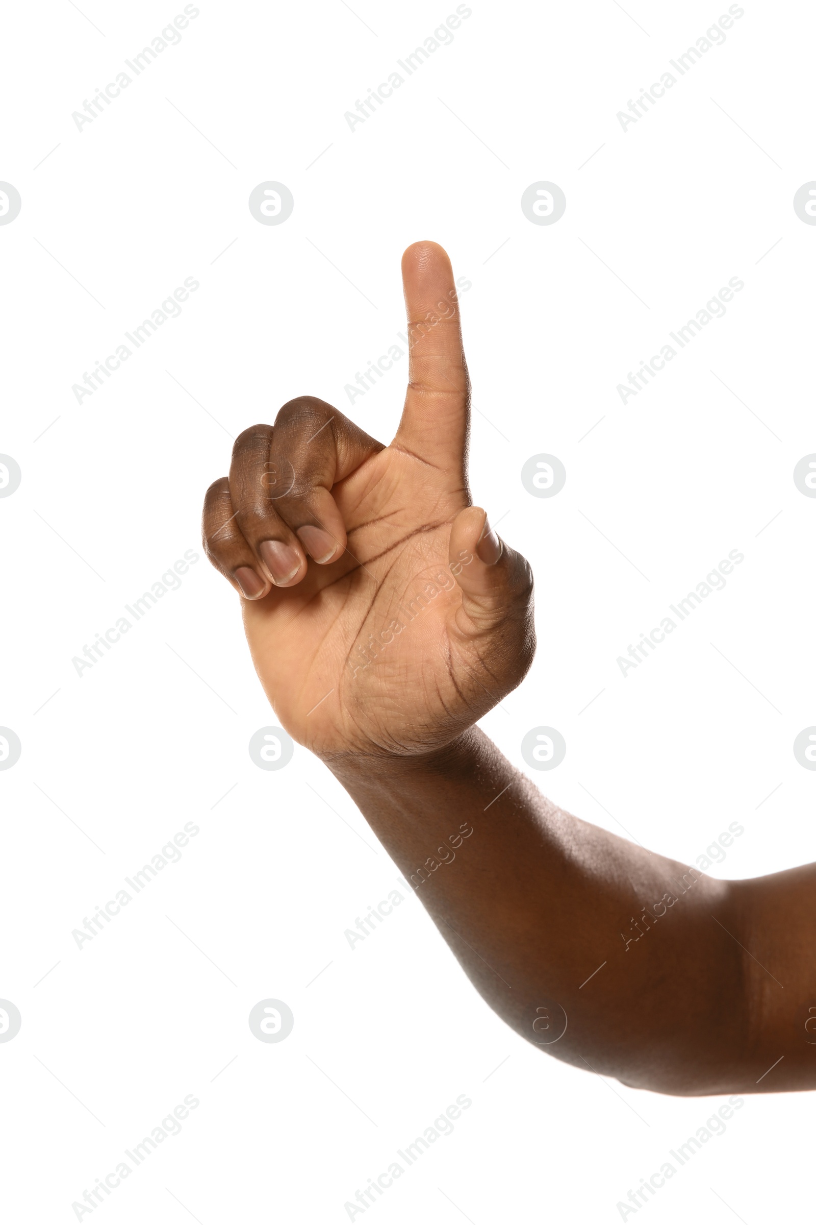 Photo of African-American man pointing at something on white background, closeup