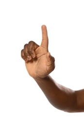 African-American man pointing at something on white background, closeup