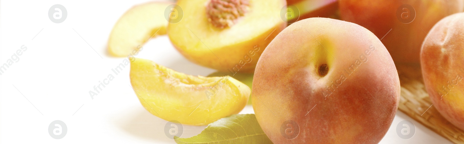 Image of Fresh ripe peaches on white table, closeup. Banner design with space for text