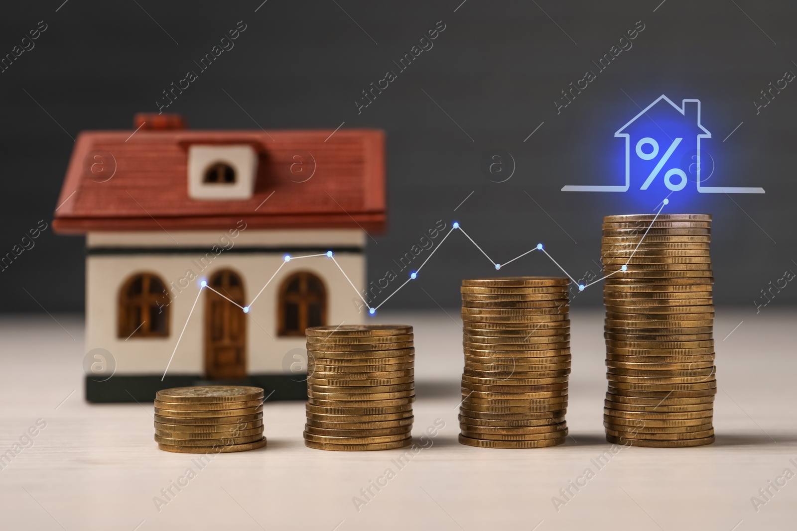 Image of Mortgage rate. Stacked coins, graph and model of house