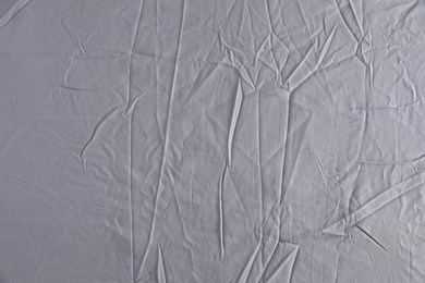 Crumpled grey fabric as background, top view