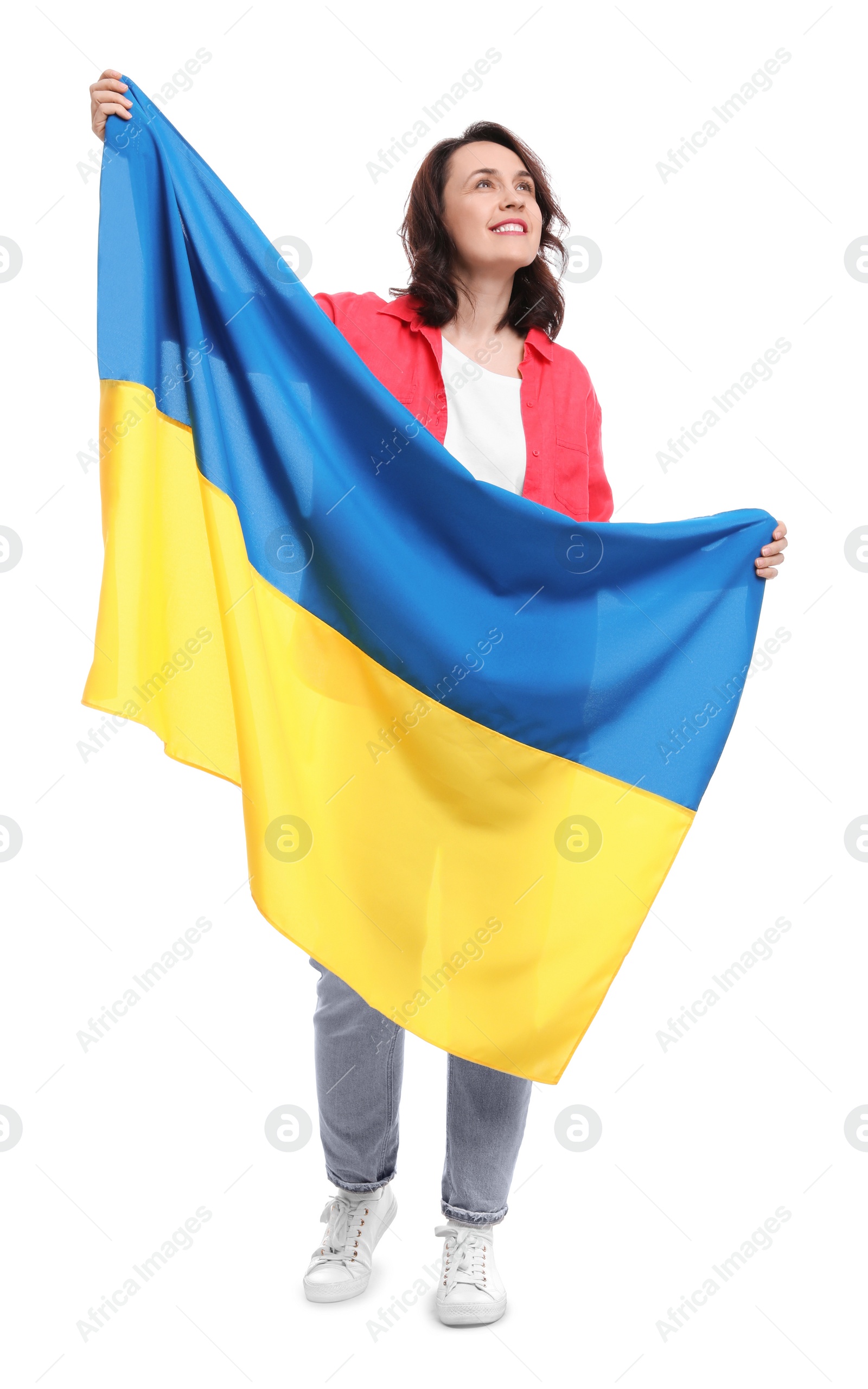 Photo of Happy woman with flag of Ukraine on white background