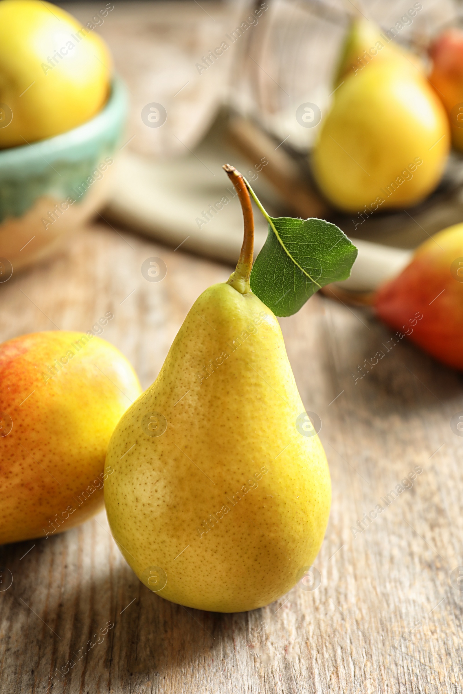 Photo of Ripe pears on wooden table. Healthy snack