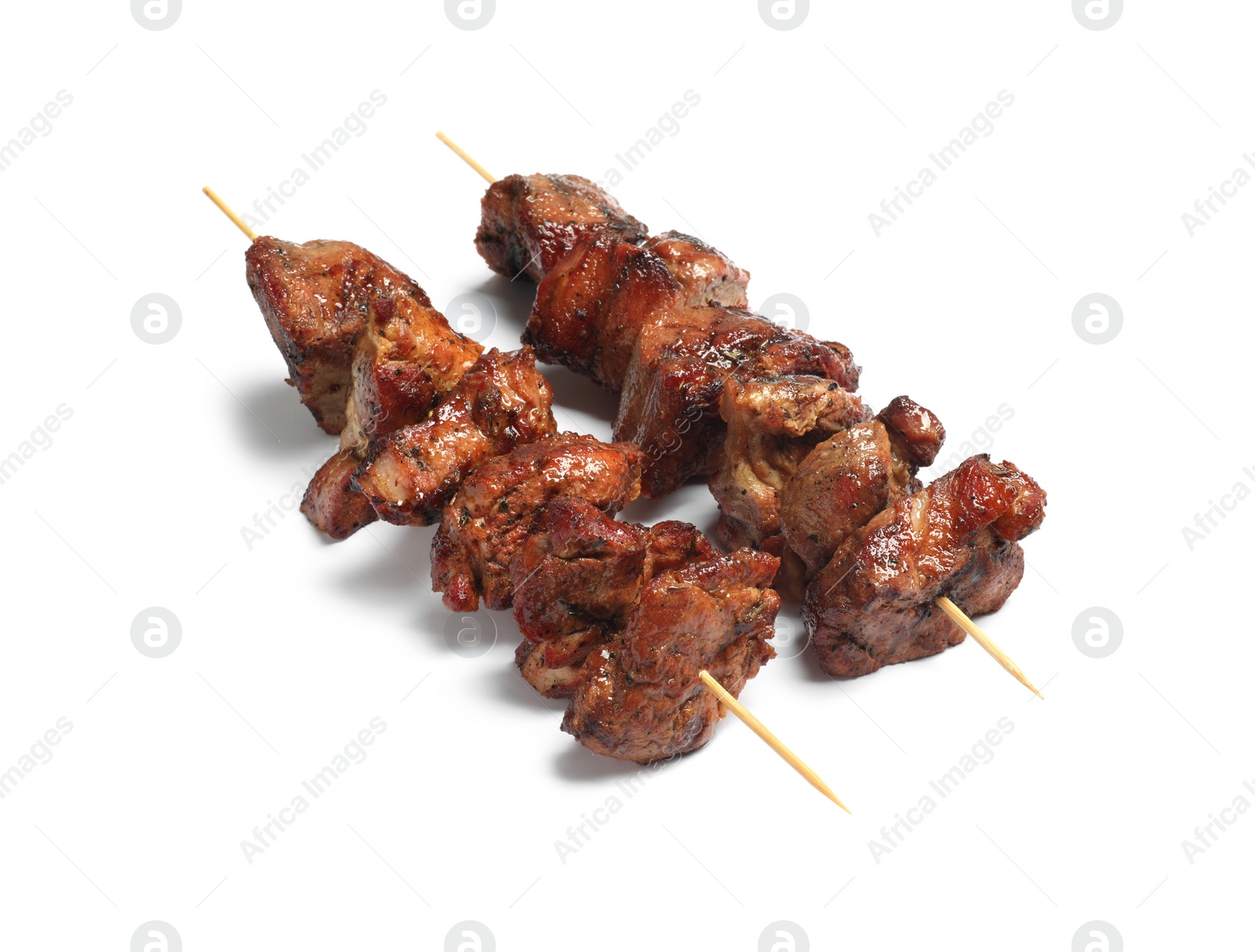 Photo of Wooden skewers with delicious shish kebabs isolated on white